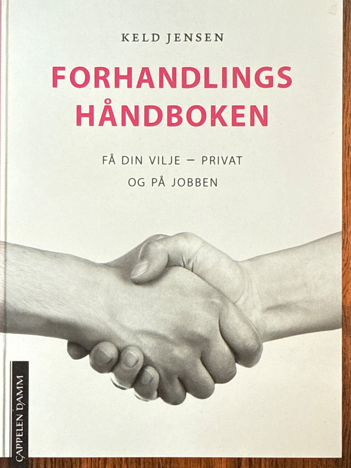 Forside av Forhandlingshåndboken av Keld Jensen 